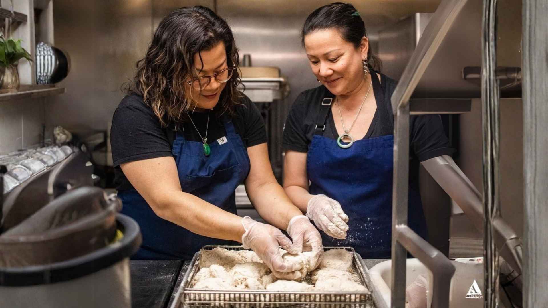 Chef Nicole Gomes and sister Francine gomes cooking in the kitchen